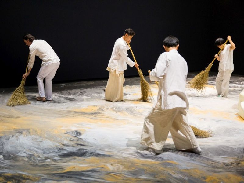 Lee Mingwei, Guernica in Sand, 2006–present. Mixed media interactive installation, Sand, wooden island, lighting, 1300 x 643 cm Installation view Lee Mingwei and His Relations, Taipei Fine Arts Museum, 2015 Courtesy: Taipei Fine Arts Museum