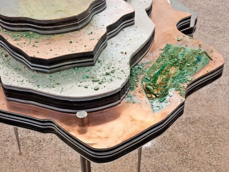 Otobong Nkanga, Solid Maneuvers, 2015. Various metals, Forex, acrylic, tar, salt, make-up, vermiculite, Dimensions variable Installation view Crumbling Through Powdery Air, Portikus, 2015 Photo: Helena Schlichting, courtesy: Portikus